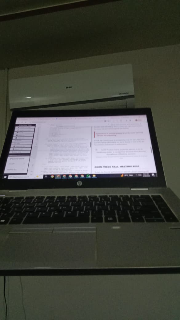 The HP ProBook laptop positioned adjacent to an air conditioning system to recover from structural thermal lockup during heavy multitasking execution.