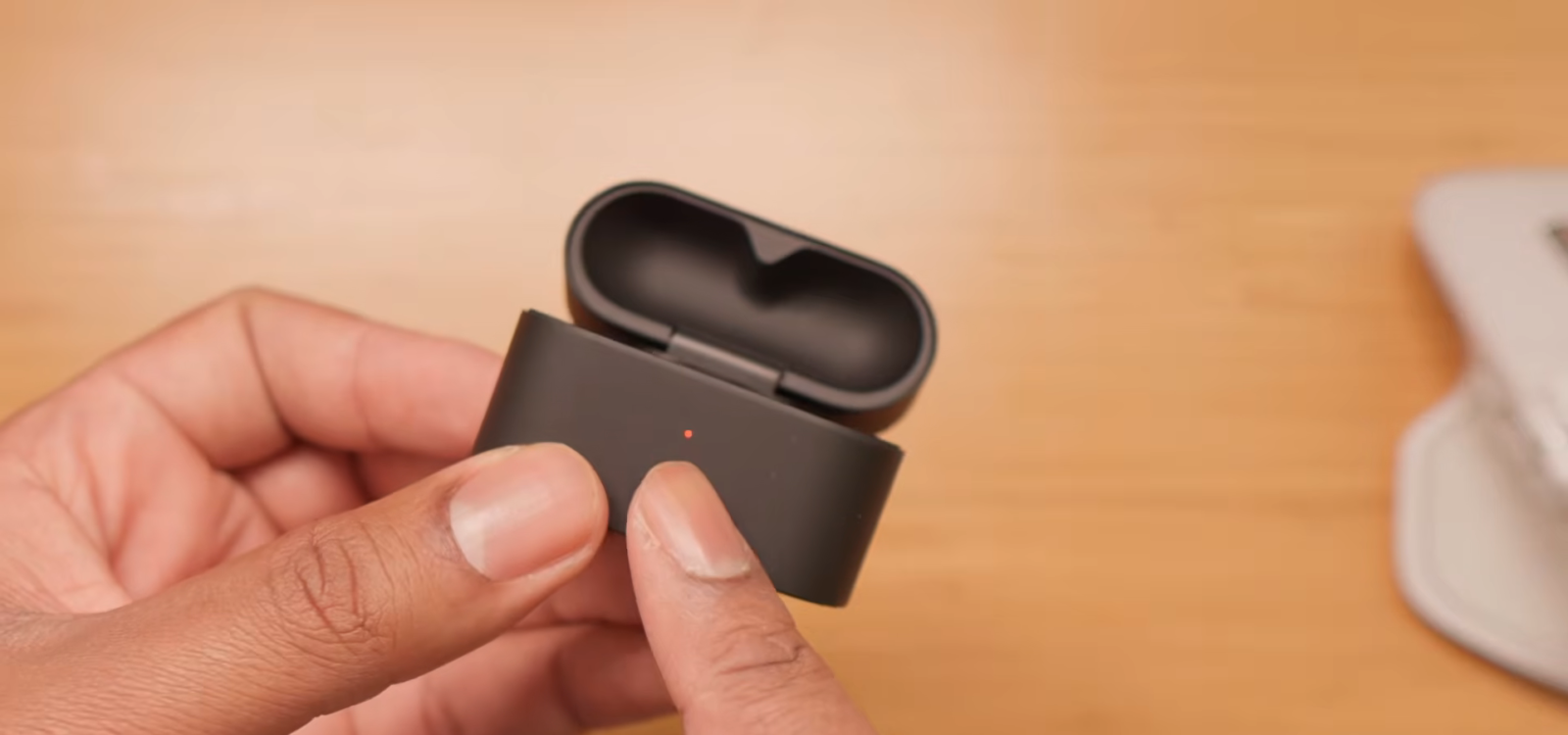 Sony WF-1000XM6 charging case showing the LED indicator light.