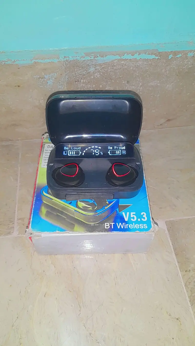 Three different M10-branded TWS earbud cases from different sellers side by side, showing mismatched sizes and designs.